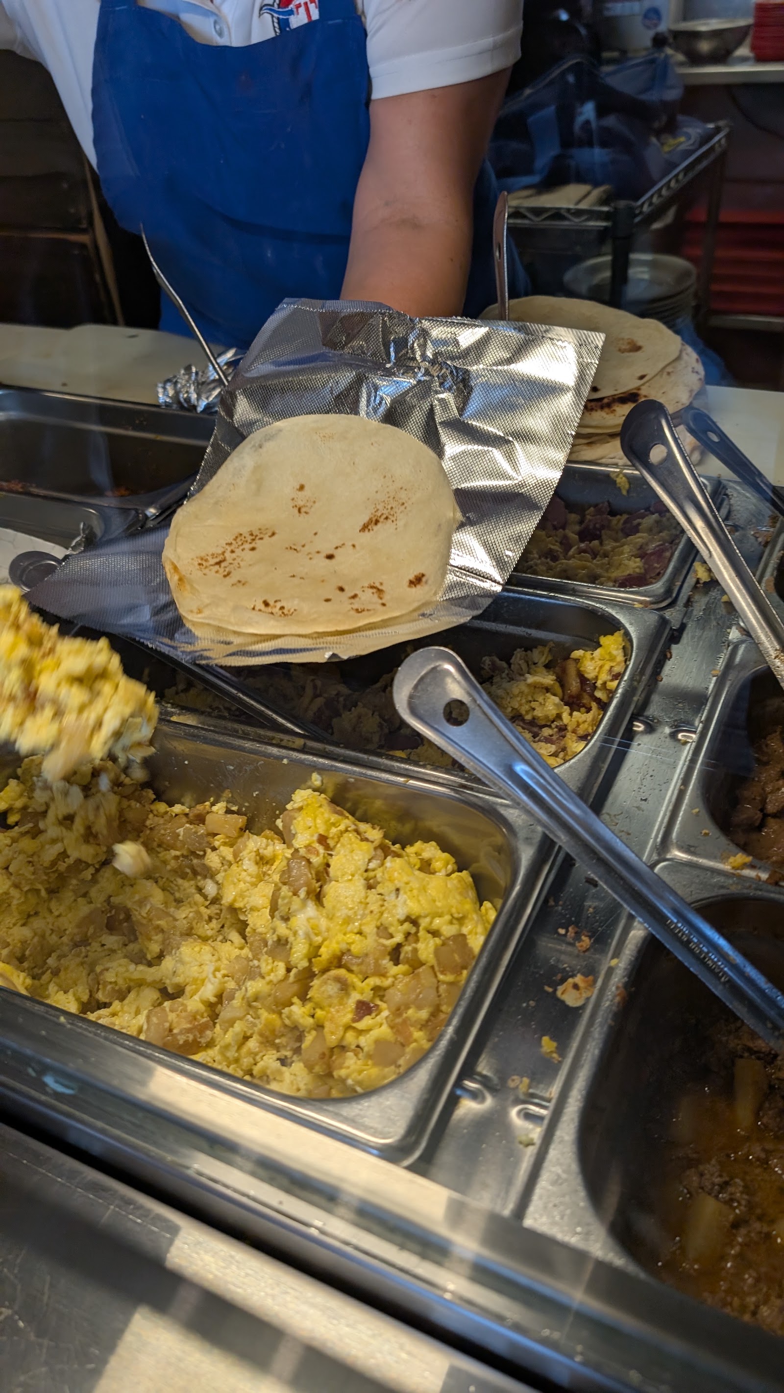 Customers enjoying a meal at Texas Tacos